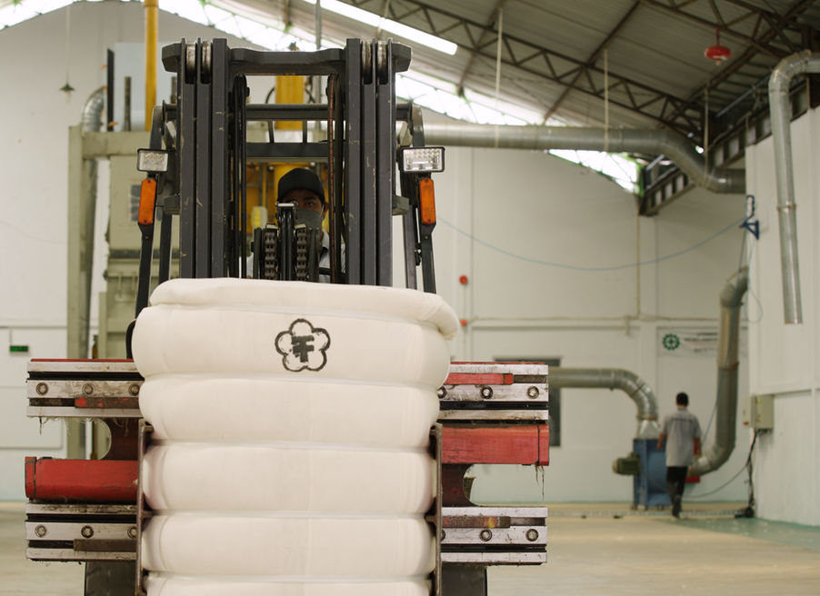 A forklift with a stack of white material

AI-generated content may be incorrect.